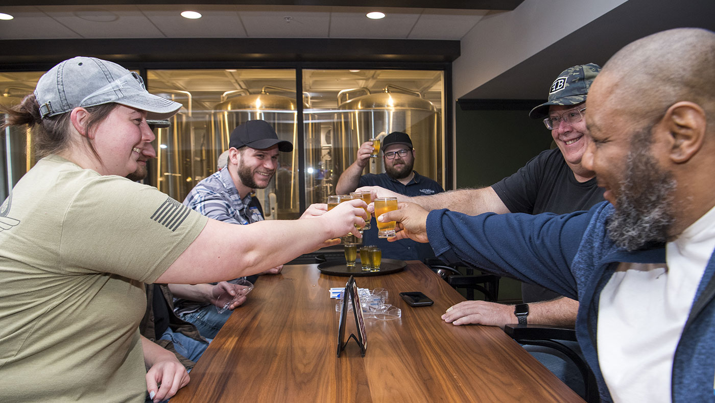 Foundations of Brewing Science and Brewery Operations participants have a beer toast